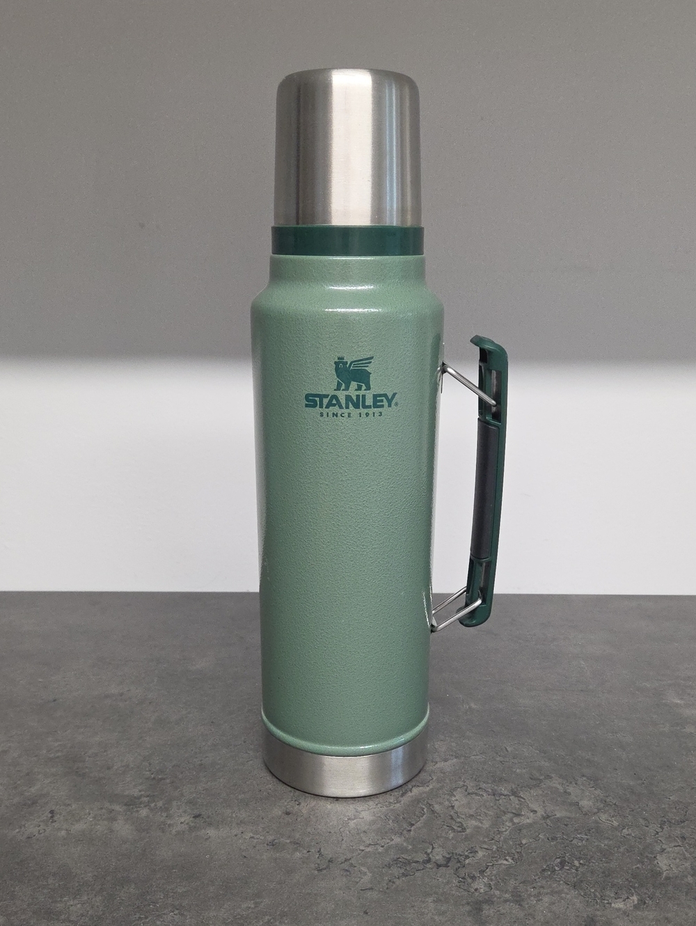 Stanley Green Vacuum Bottle with Stainless Cap and Fold Handle